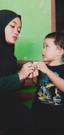 Kader Posyandu Kalurahan Giripanggung Laksanakan Pemberian Obat Cacing untuk Balita